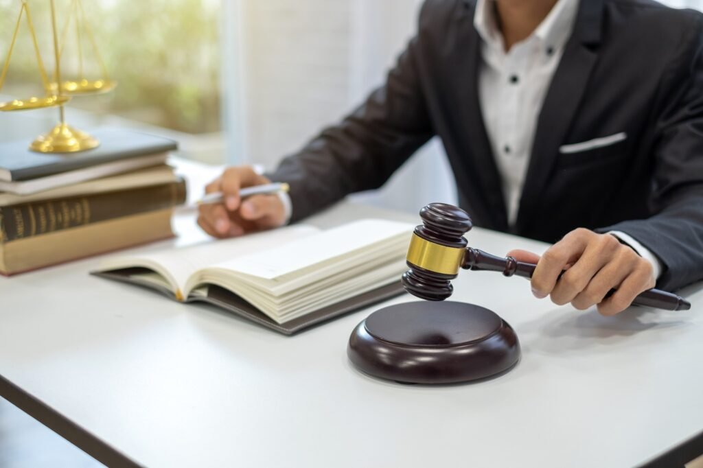 Lawyer sitting open the book and working in law firm.